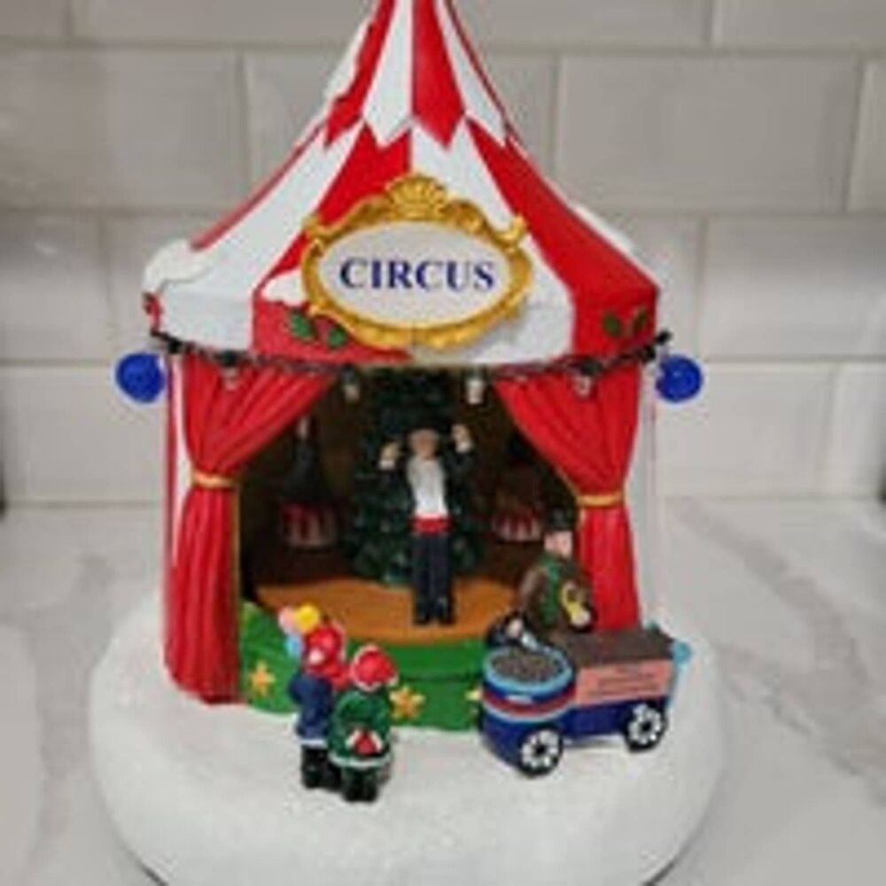 St. Nicholas Square Village Circus tent with lights, music, and motion